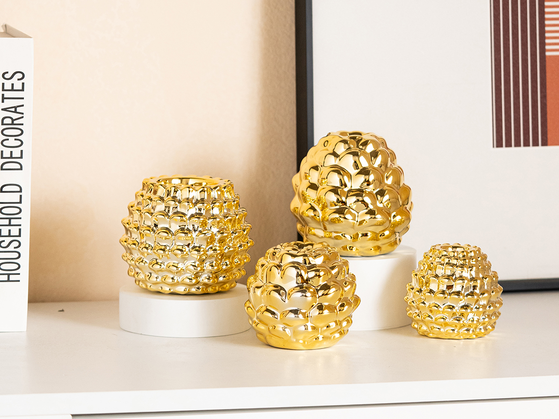 Electroplate gold pinecone candle holderProducts Ys (Sano) Ceramics.